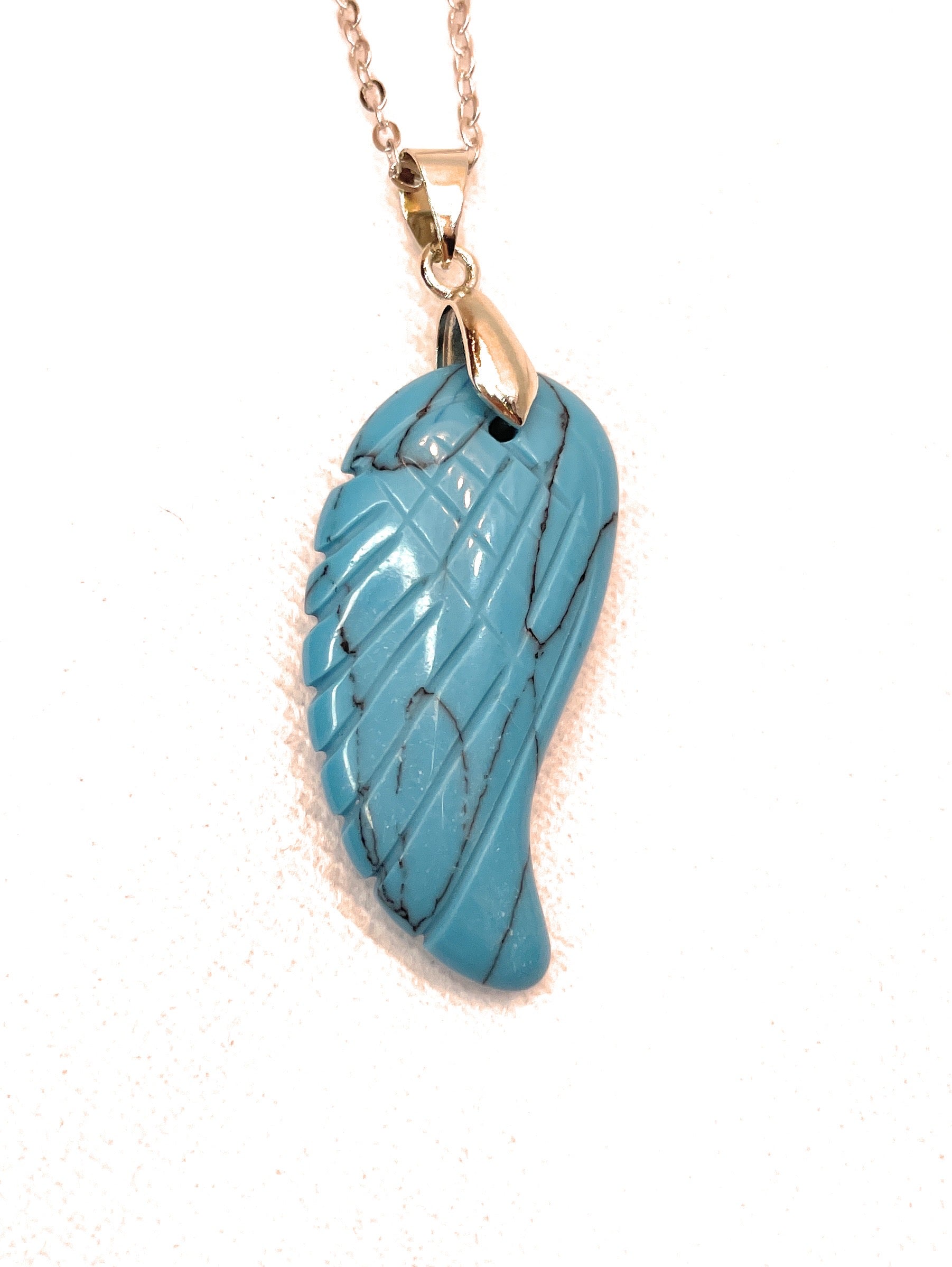 Angel Wing Crystal Gemstone Pendant - A unique handcrafted crystal piece.